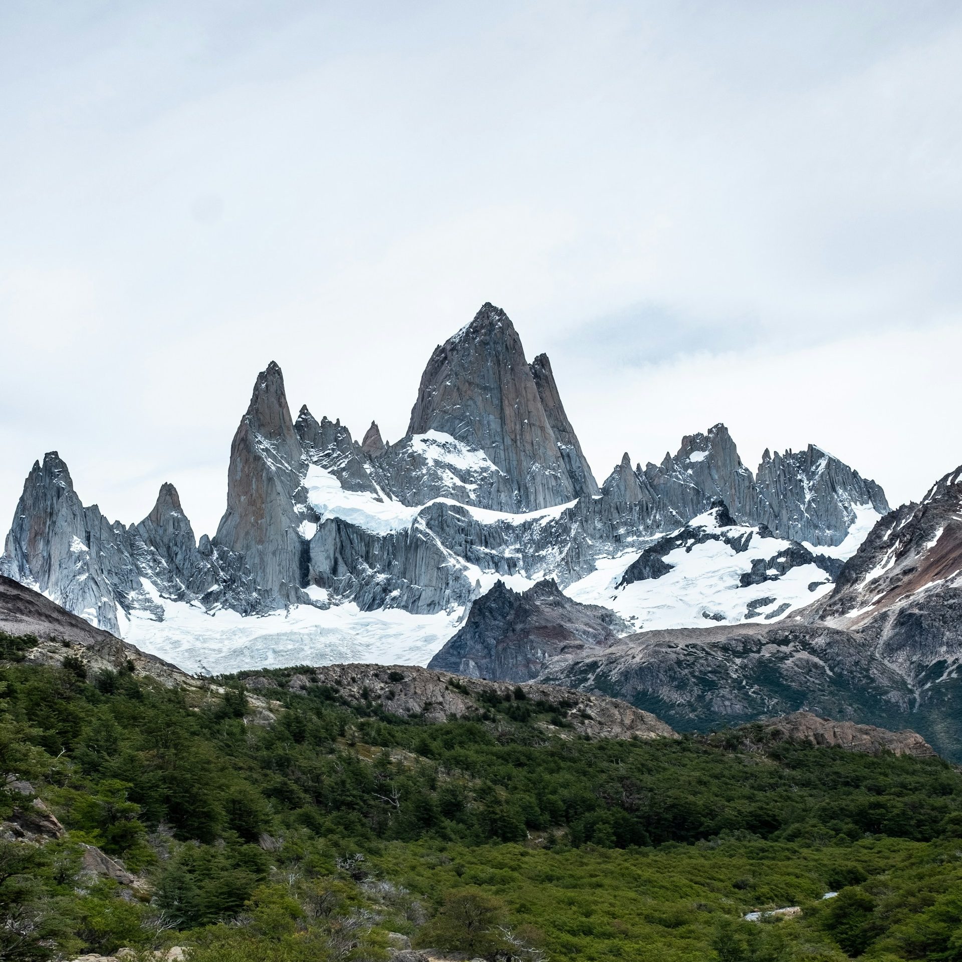 Snow-covered Fitz Roy peaks above Patagonia, Argentina