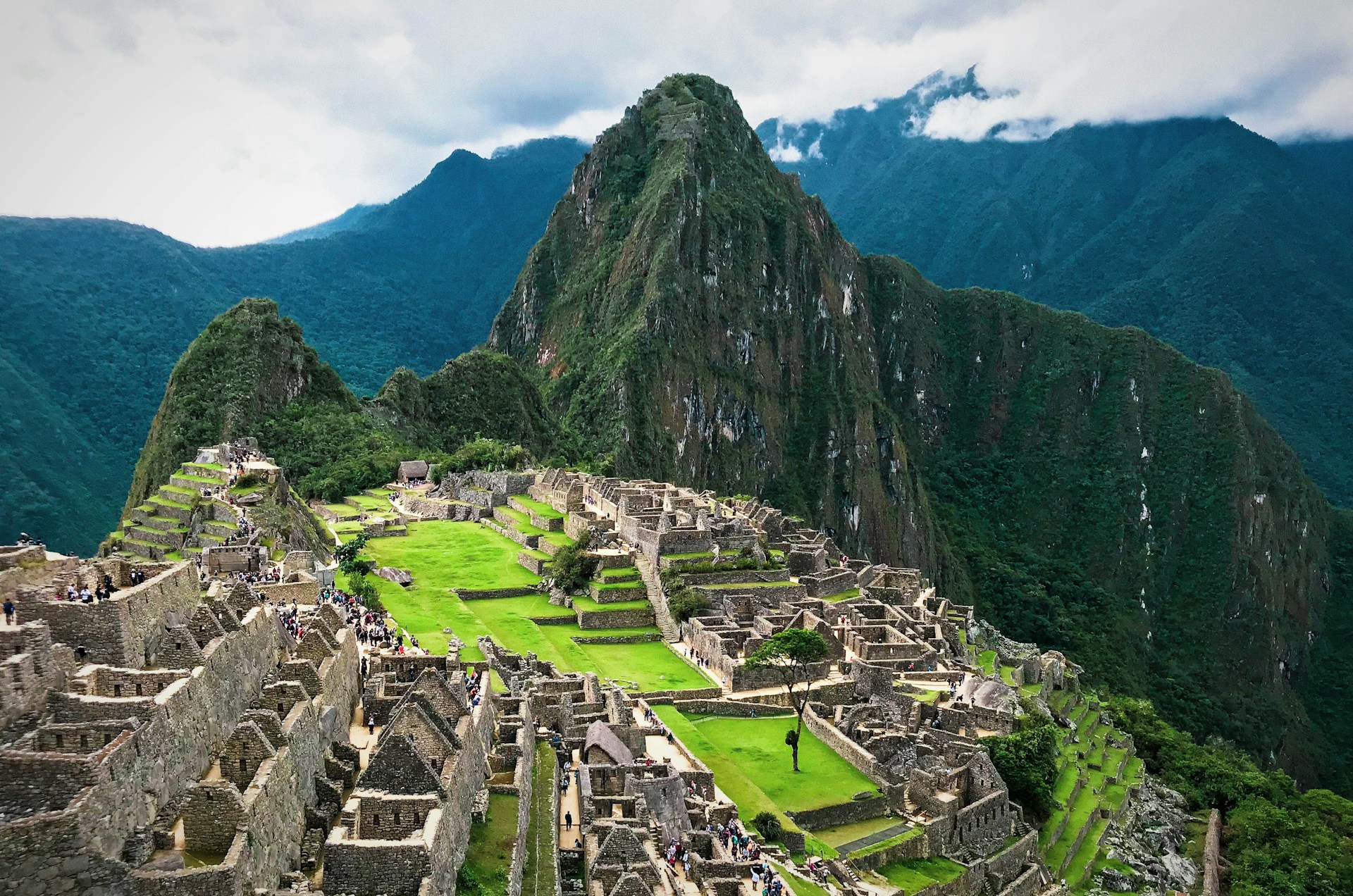 The stone ruins of Machu Picchu among green mountains in Peru