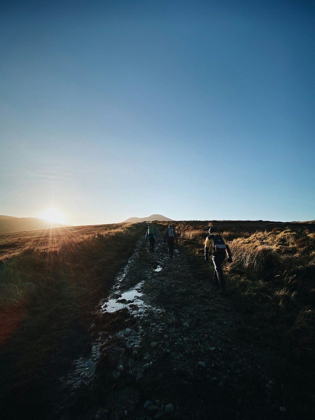 A hiker walking through the mountains of County Donegal, Ireland