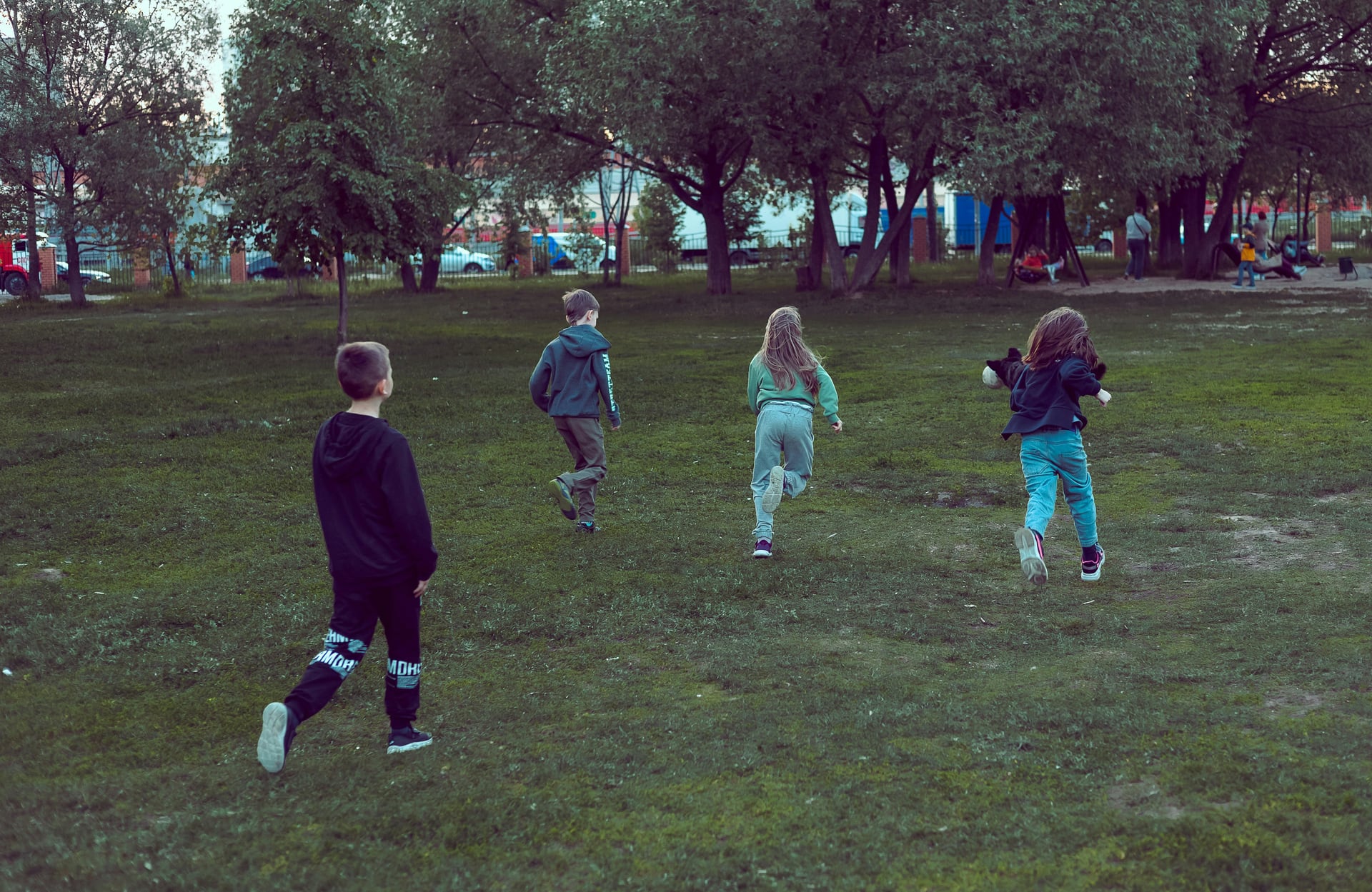 Children running together during an outdoor game