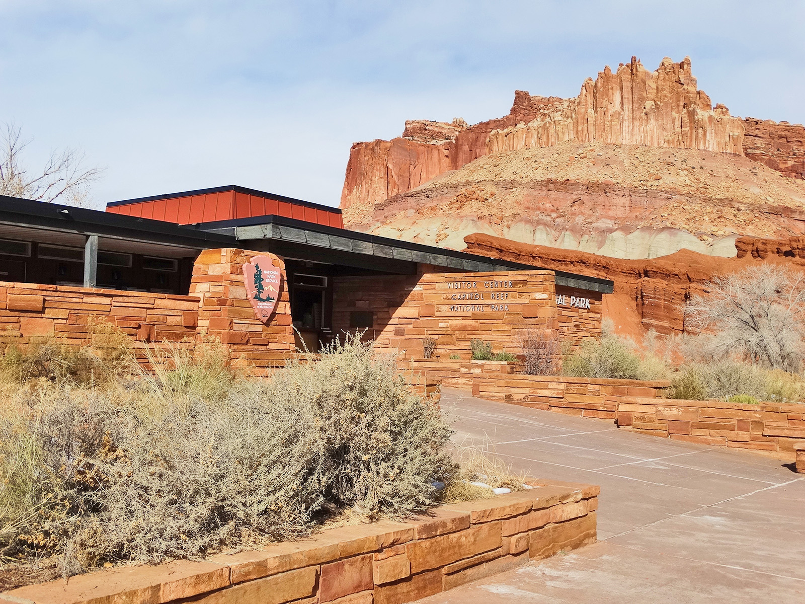 The Castle cliffs towering over the Capitol Reef Visitor Center