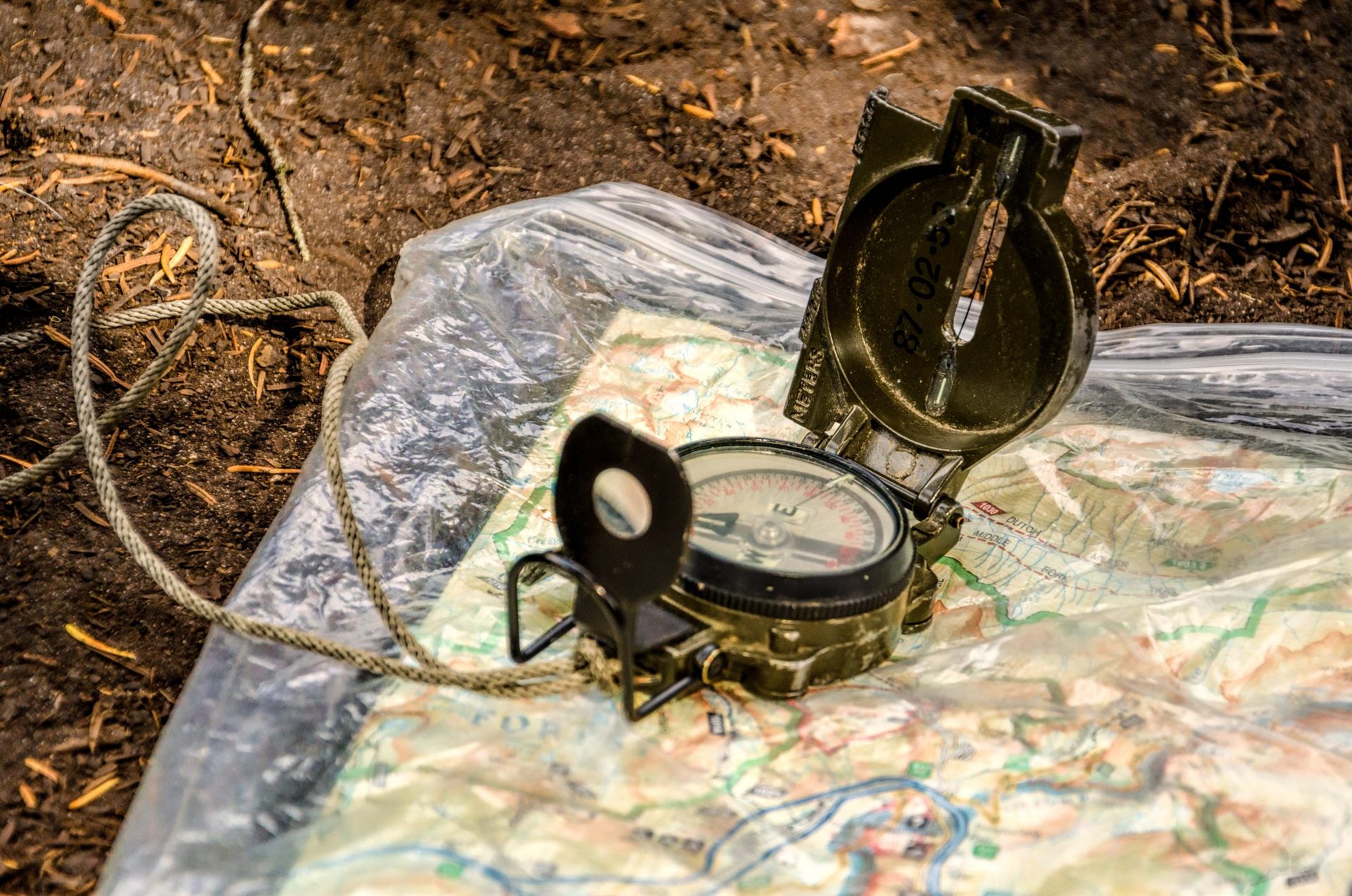 black and gray compass with map
