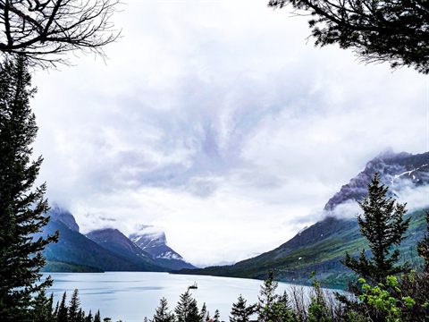 A turquoise alpine lake surrounded by mountains in Glacier National Park