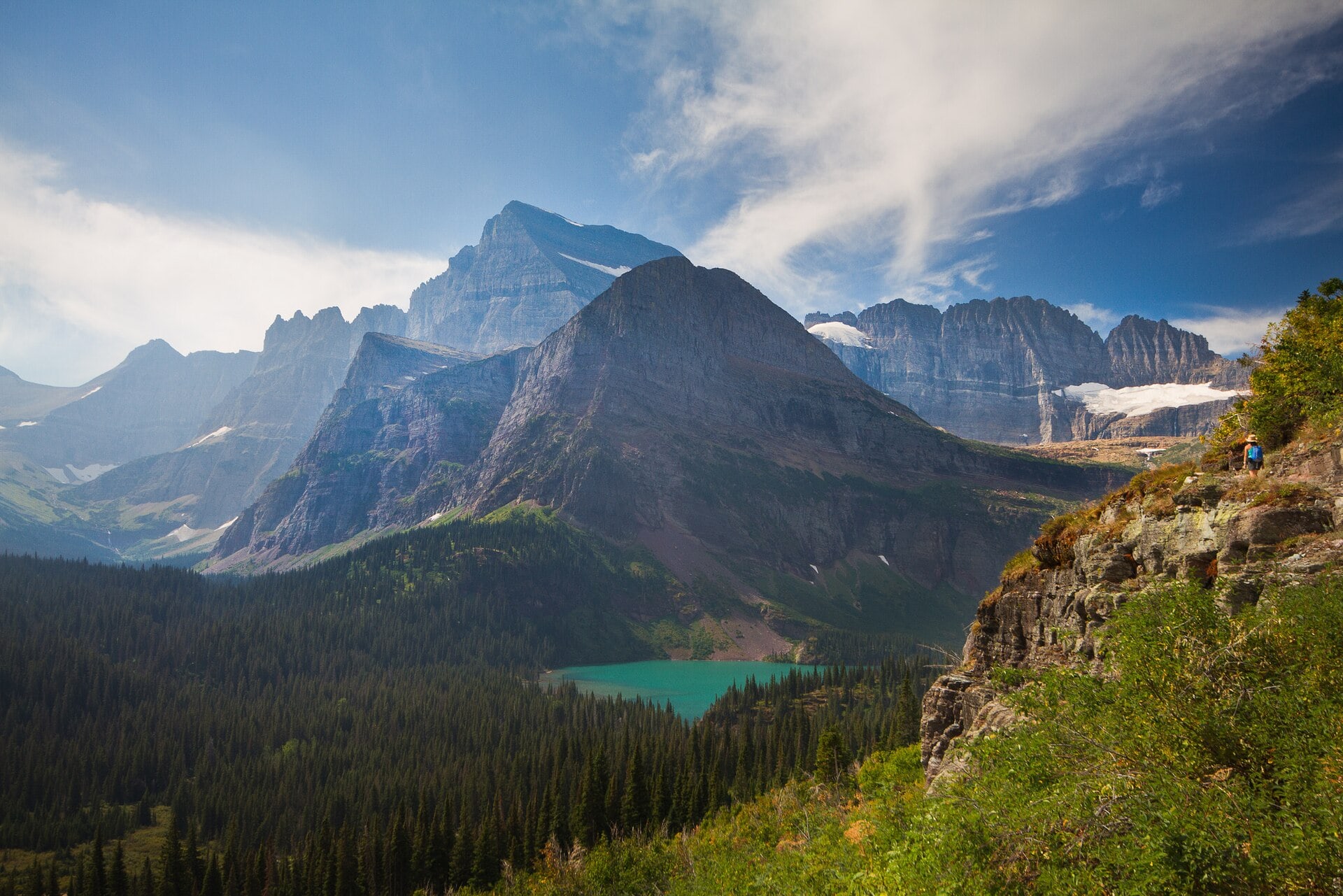 A mountain trail overlooking turquoise lakes in the Many Glacier valley