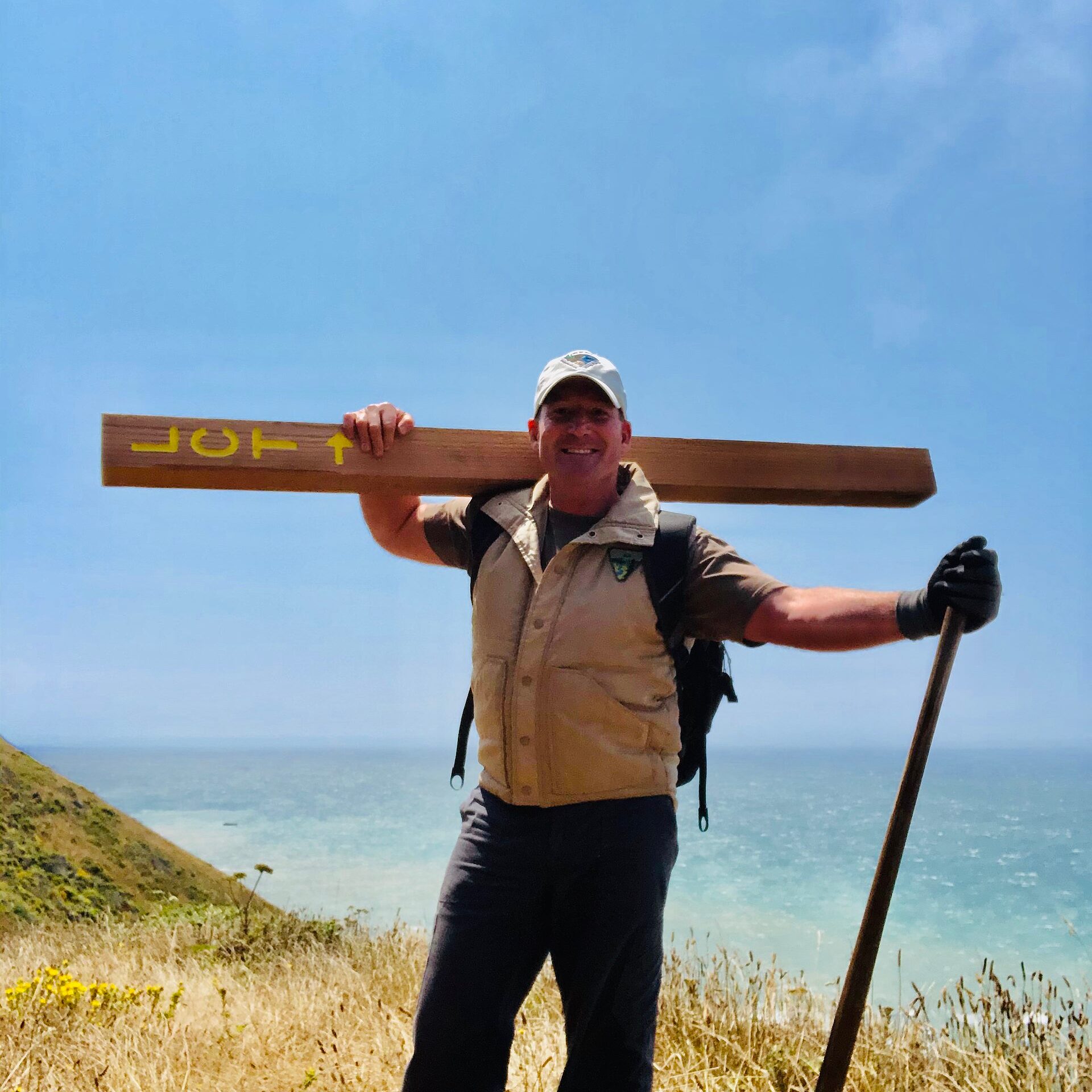 A trail worker on the Lost Coast Trail above the Pacific Ocean