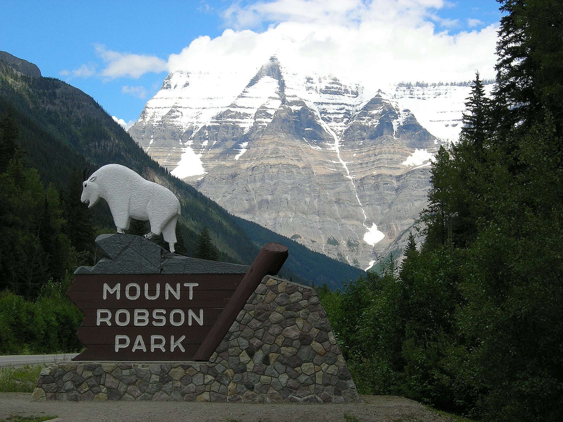 Mount Robson rising behind the entrance sign to Mount Robson Provincial Park
