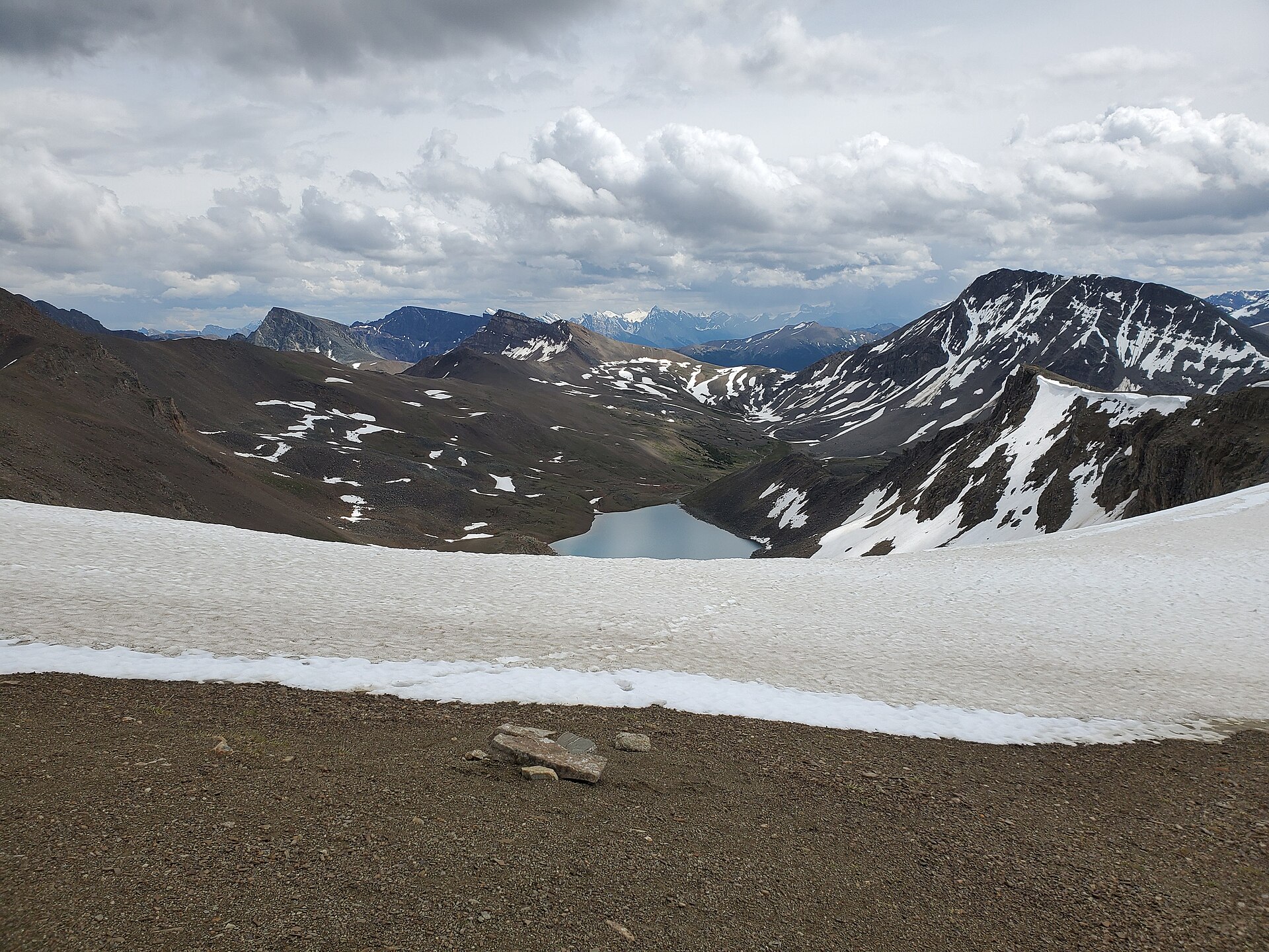 Snowfields and an alpine lake along Jasper's Skyline Trail