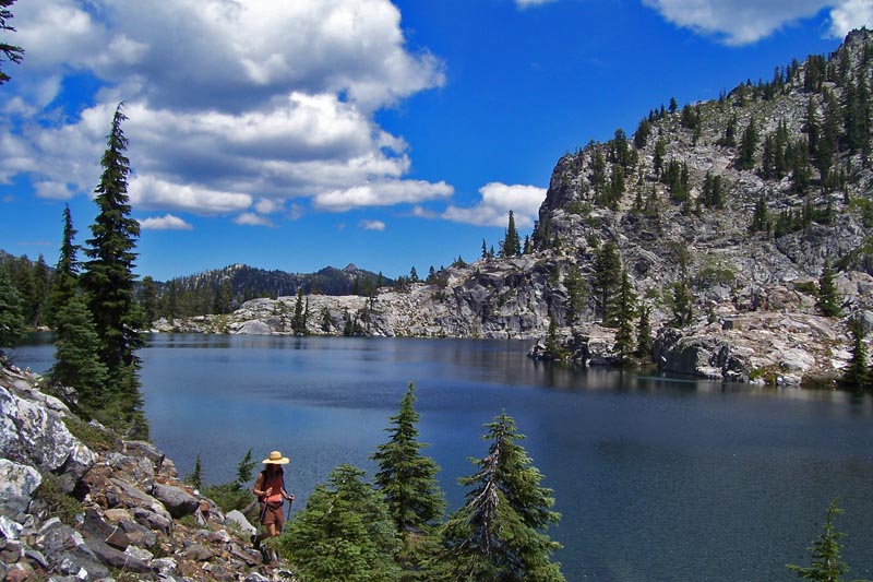 A hiker approaching Russian Lake in the Russian Wilderness