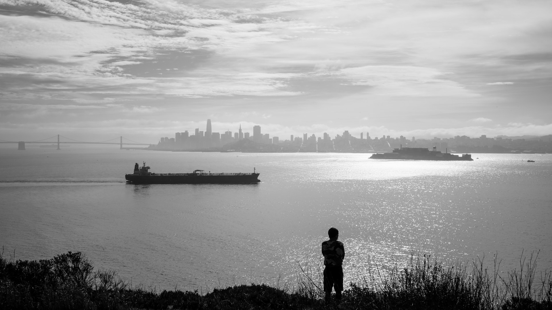 A hiker looking across San Francisco Bay from Angel Island