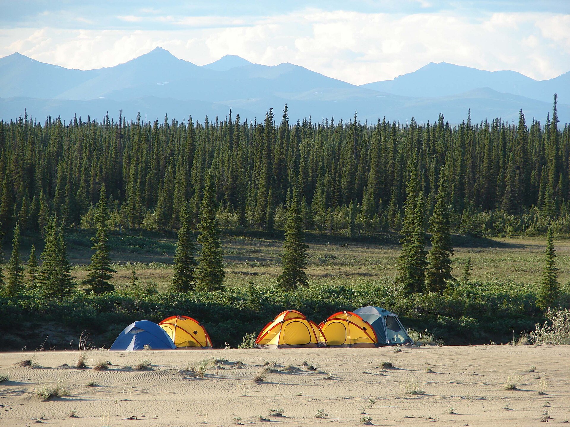 Tents pitched on the Kobuk sand dunes beneath the mountains