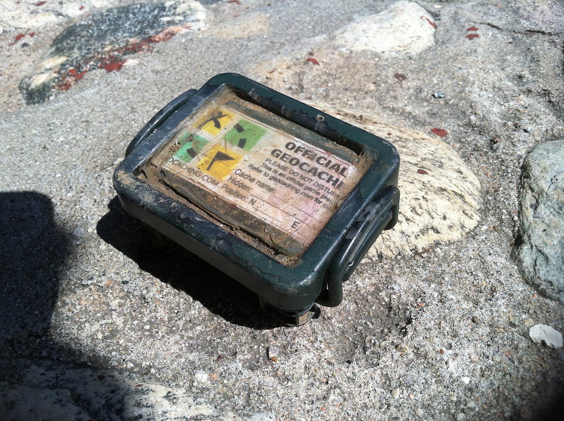 An official weatherproof geocache container