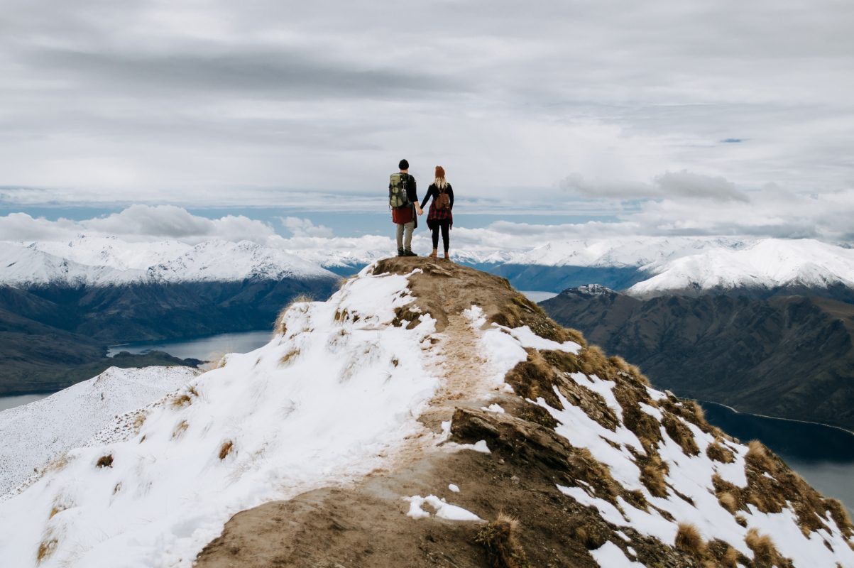 hiking couple on peak