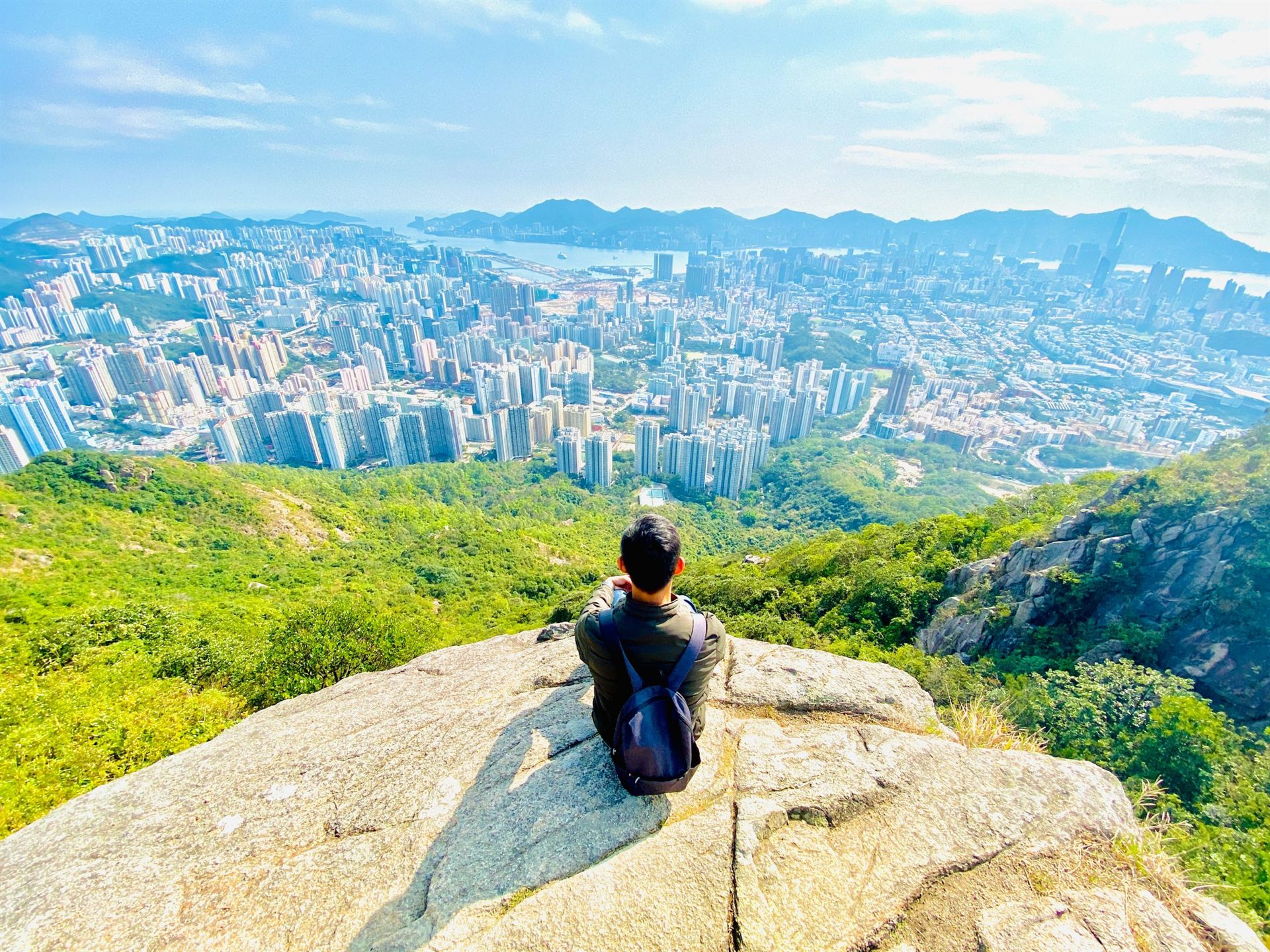hiker in Hong kong with city in the background