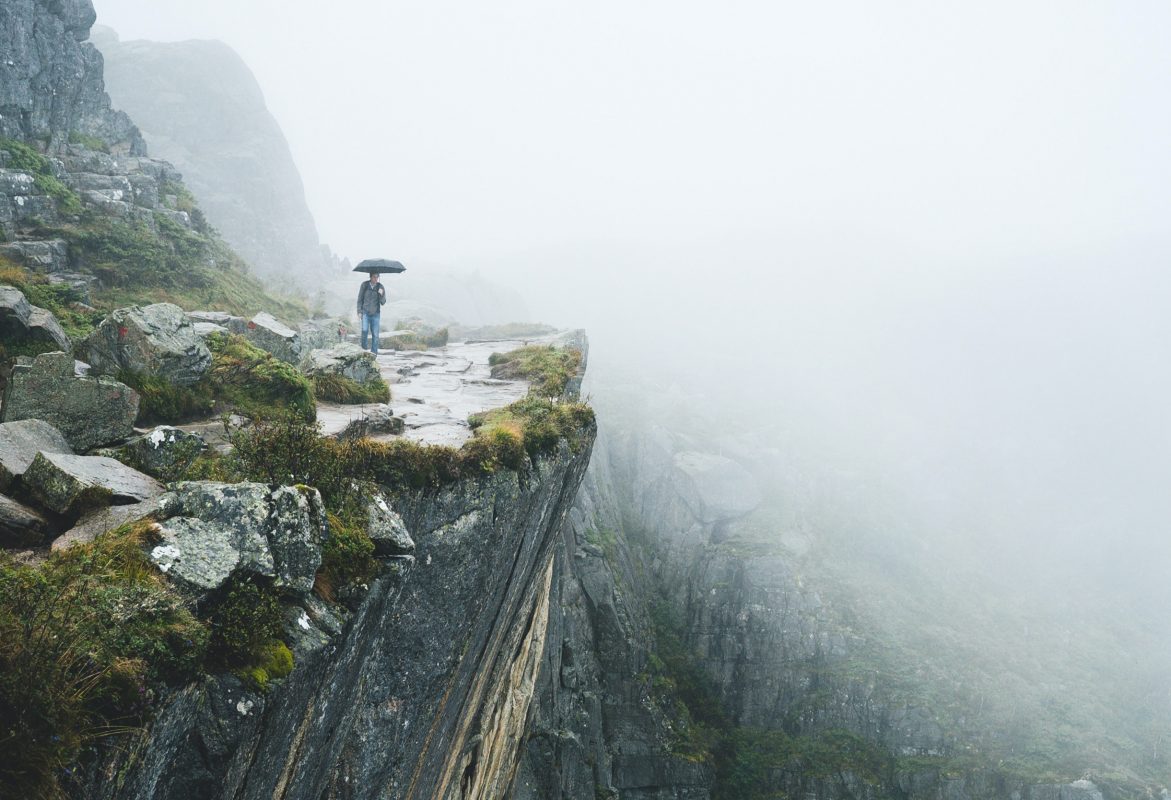 Hiker with umbrella in the rain