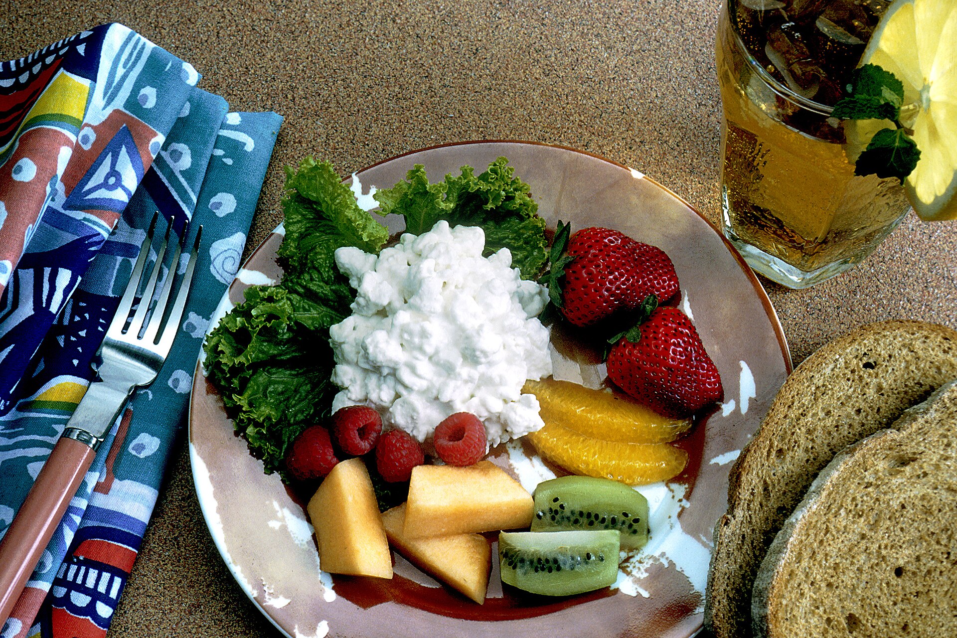 A balanced snack with fruit, bread, and protein