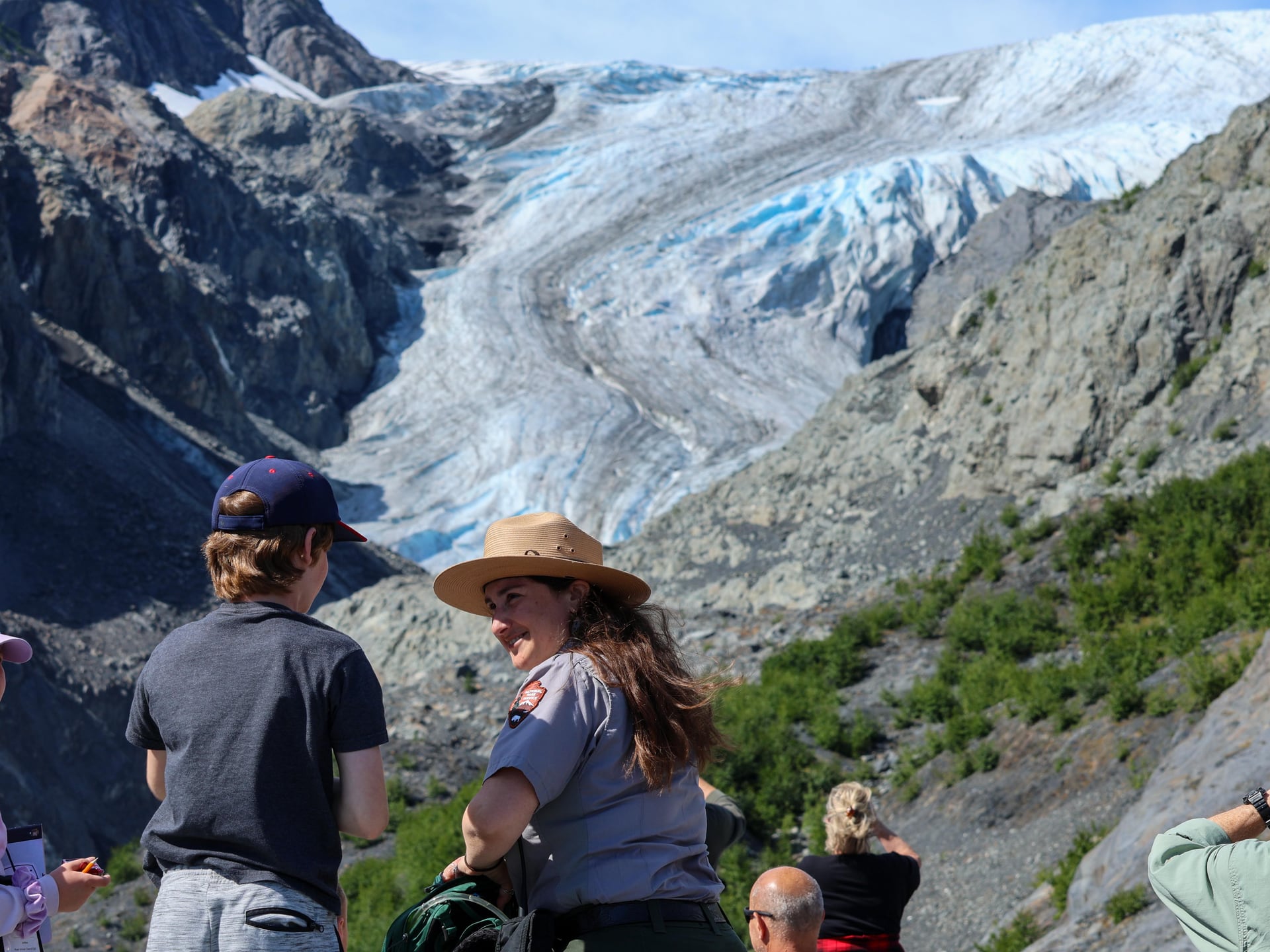 A ranger and child viewing Exit Glacier