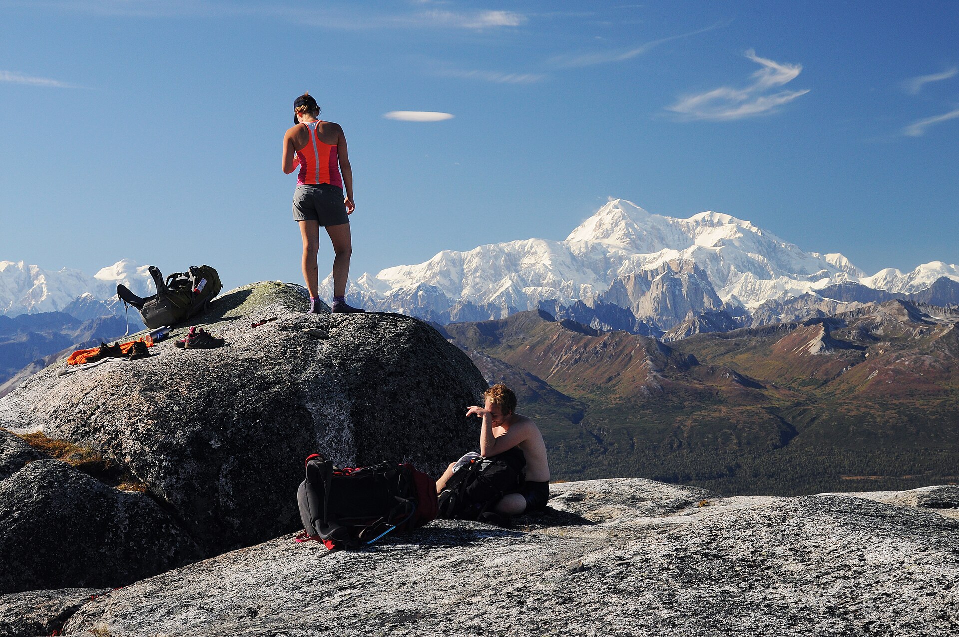 A hiker overlooking Denali from Kesugi Ridge