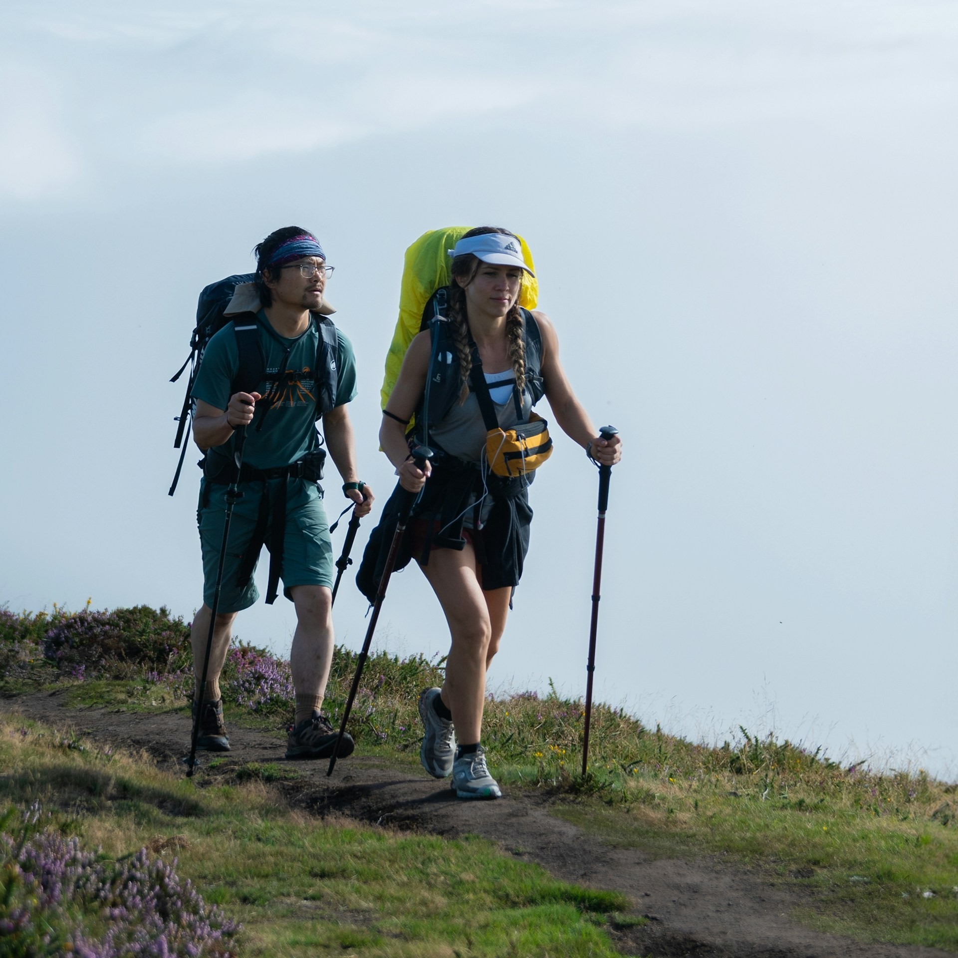 Pilgrims hiking through the hills on the Camino de Santiago