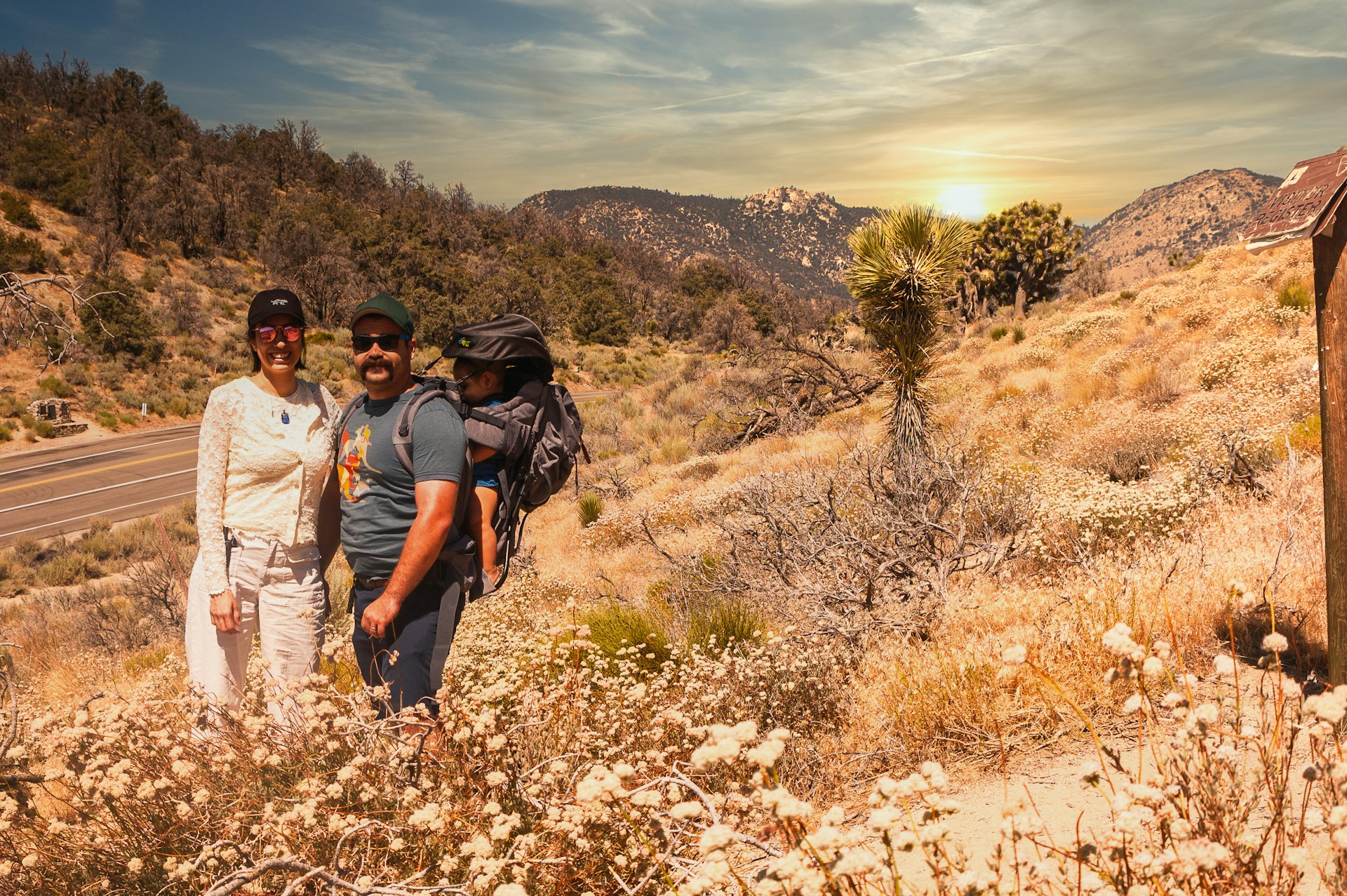 A family hiking through the dry landscape of the Pacific Crest Trail
