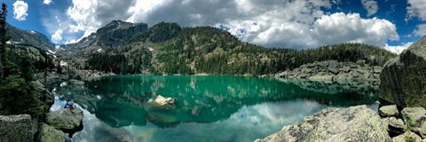Turquoise alpine lake surrounded by mountains in Banff National Park