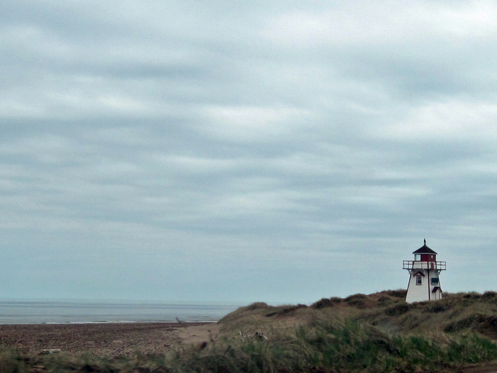 Covehead Harbour Lighthouse beside the shore in Prince Edward Island National Park