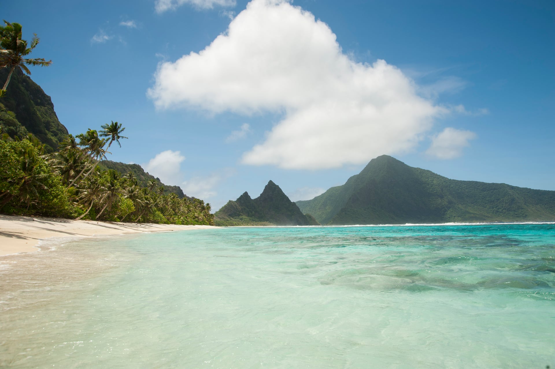The white sand, turquoise lagoon, and mountains of Ofu Island
