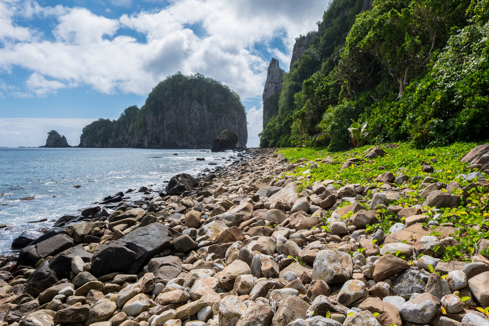 The rocky coast and Pola Island beside the Tuafanua Trail on Tutuila