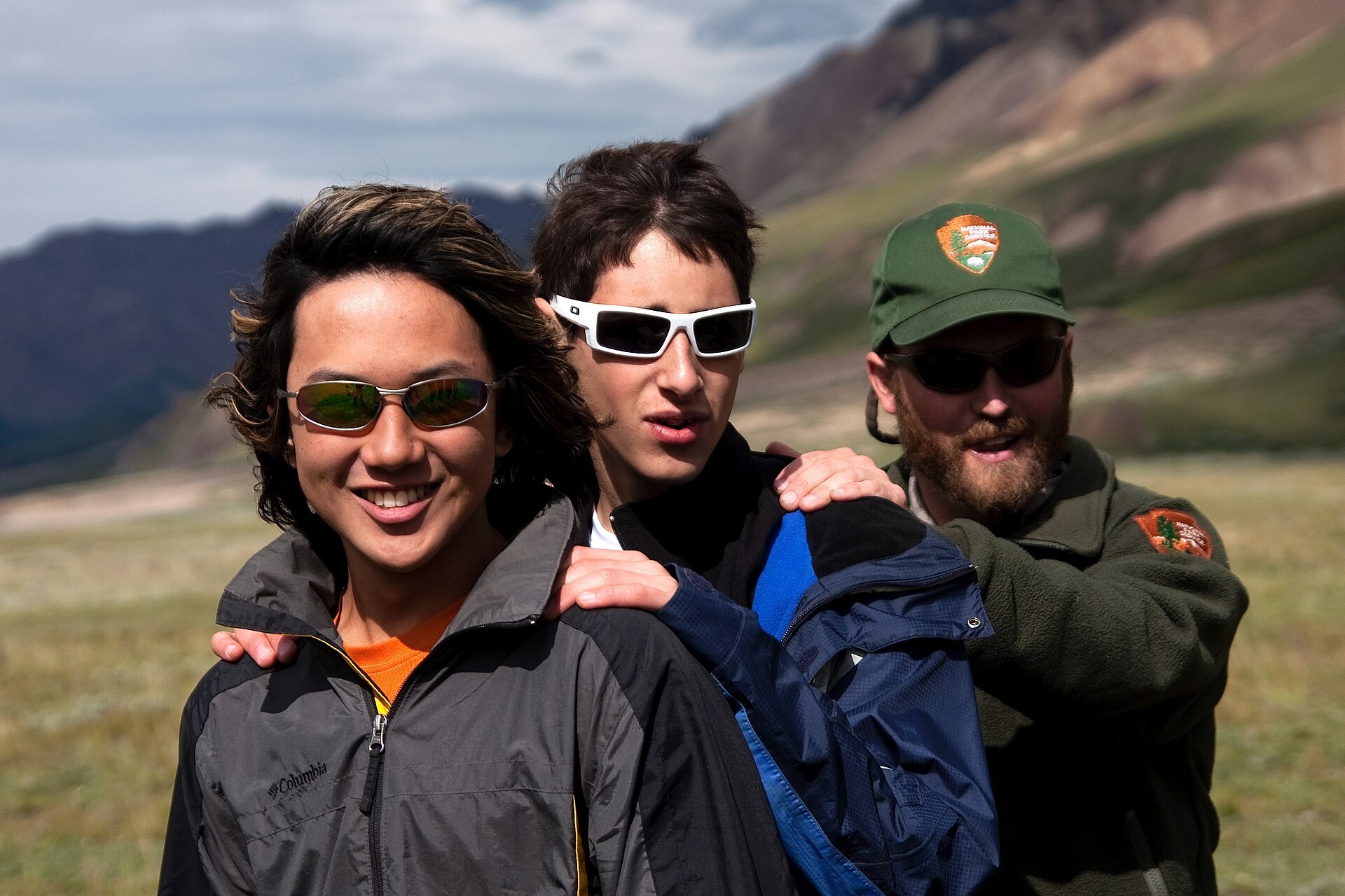 A group practicing a linked river-crossing technique in Denali