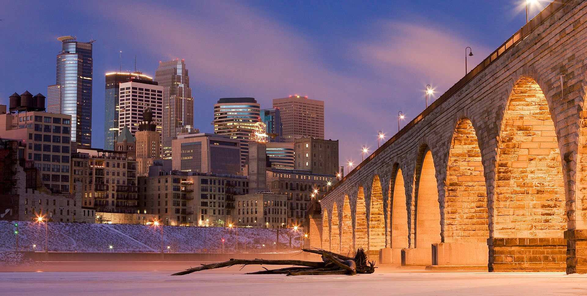 Downtown Minneapolis and the Stone Arch Bridge beside the Mississippi River