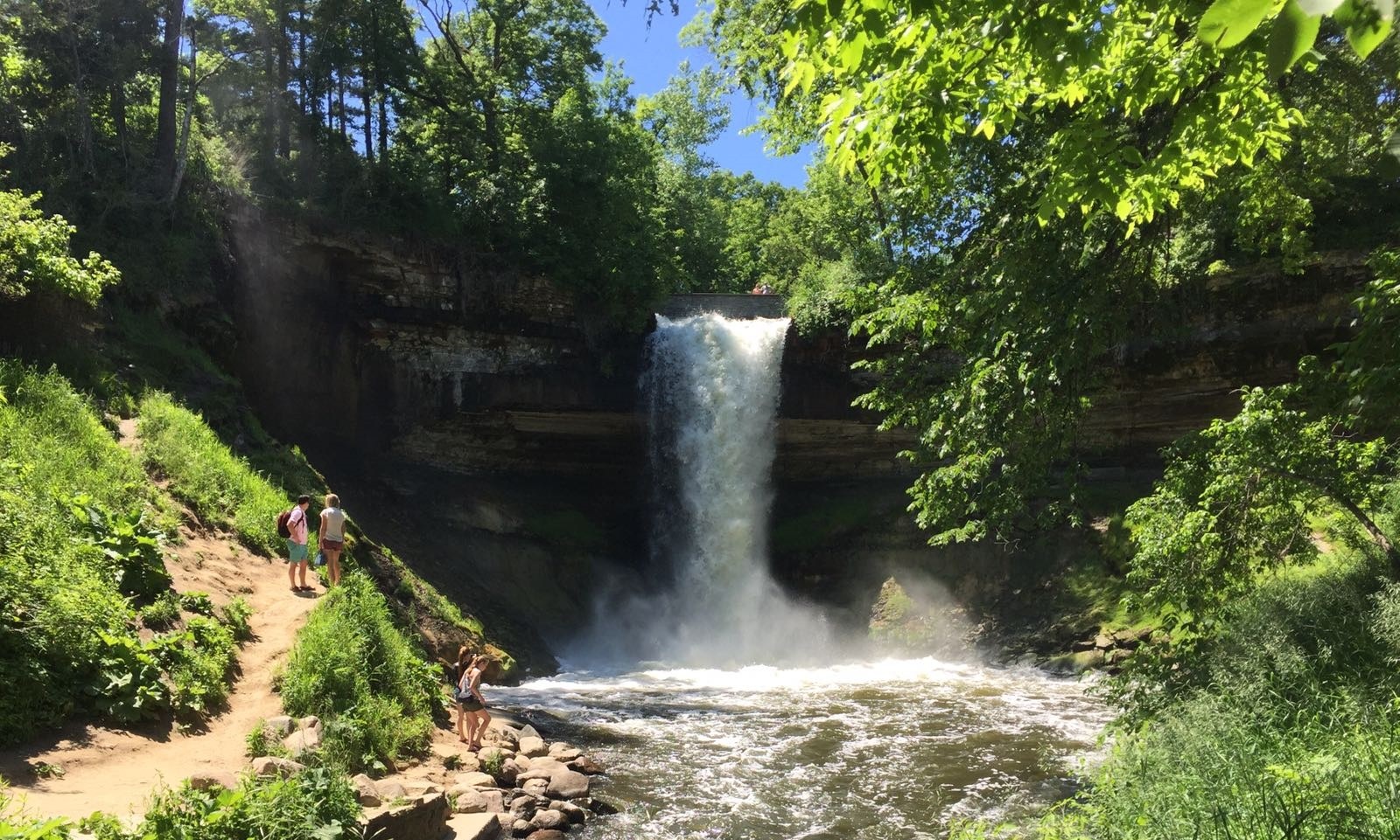 Minnehaha Falls surrounded by green woodland