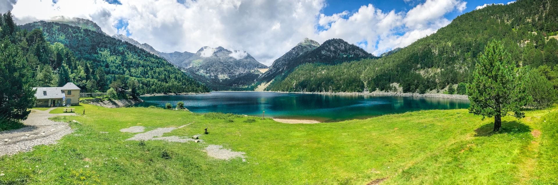 A mountain lake surrounded by green slopes in Pyrénées National Park