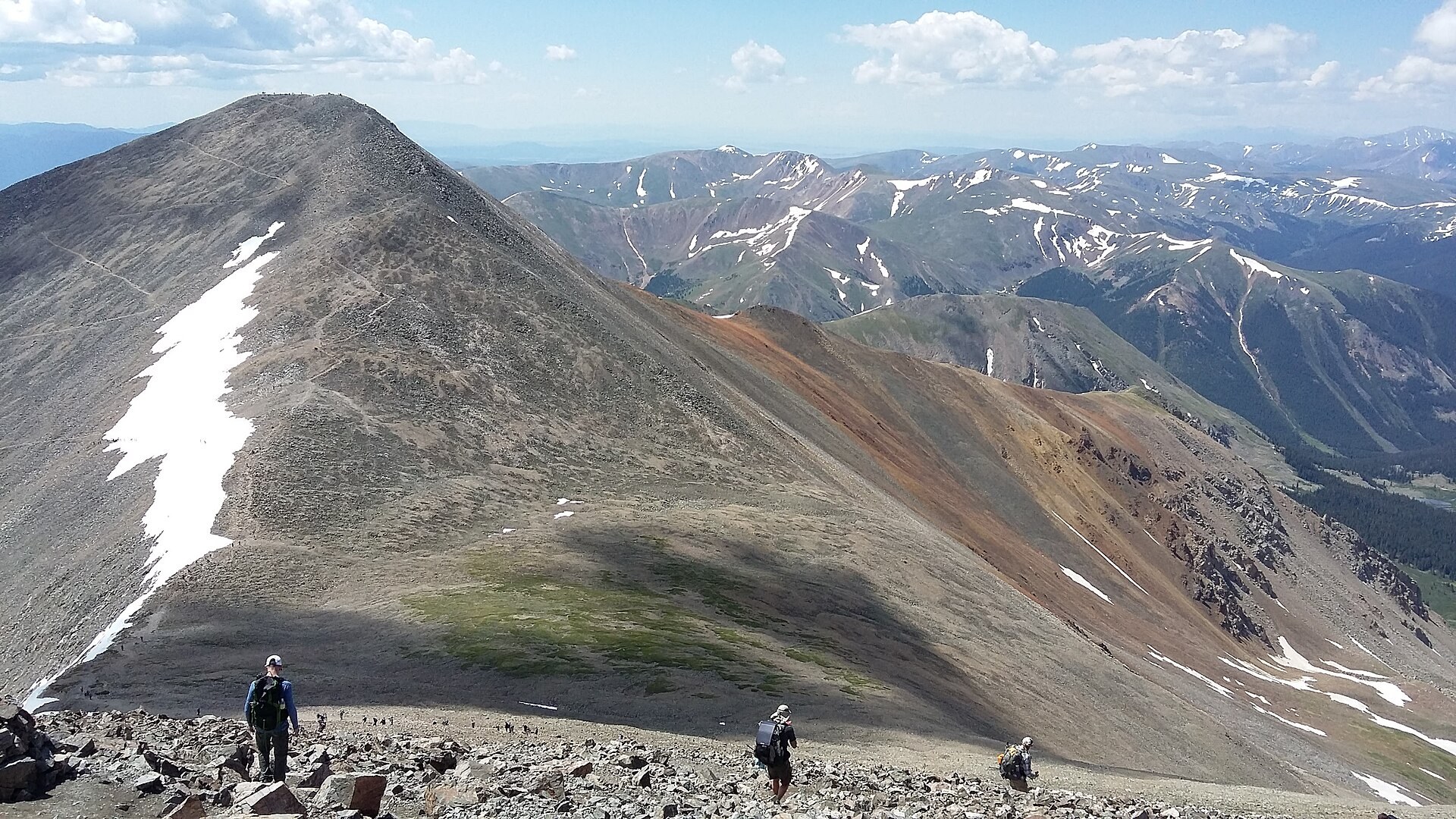 Hikers on a high ridge of the Continental Divide Trail