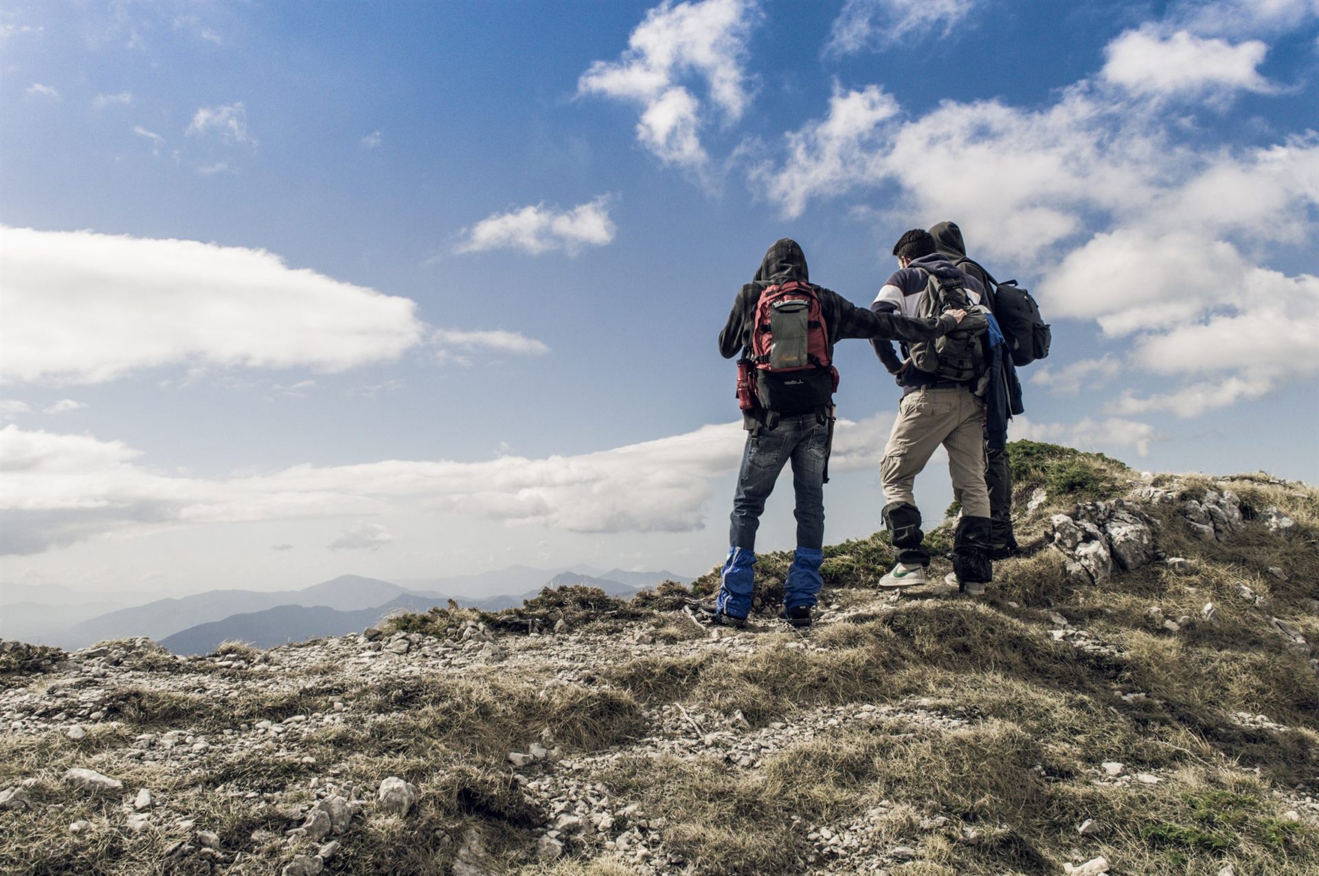 thru-hikers on hilltop during daytime