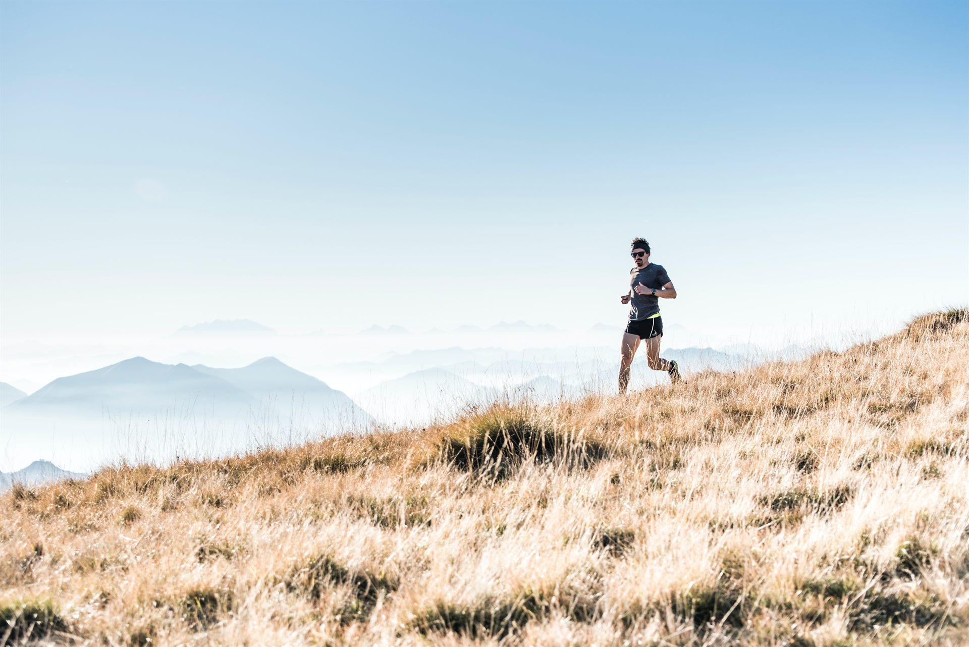 man trail running on the mountain
