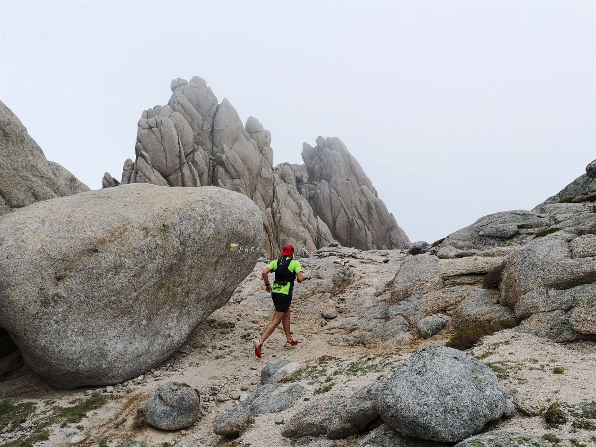 trail runner between rocks in Spain