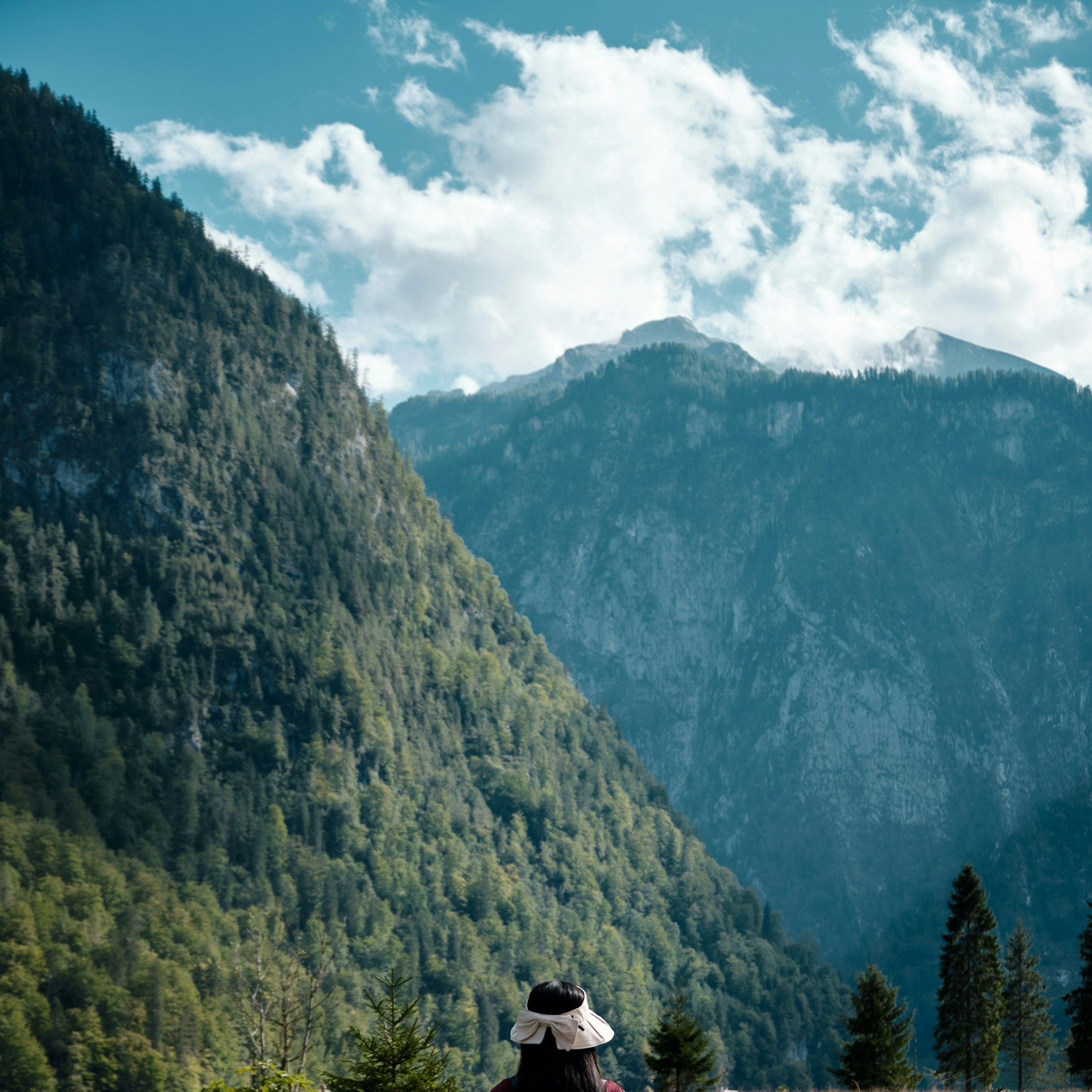 A backpacker walking a mountain trail near Königssee in Berchtesgaden