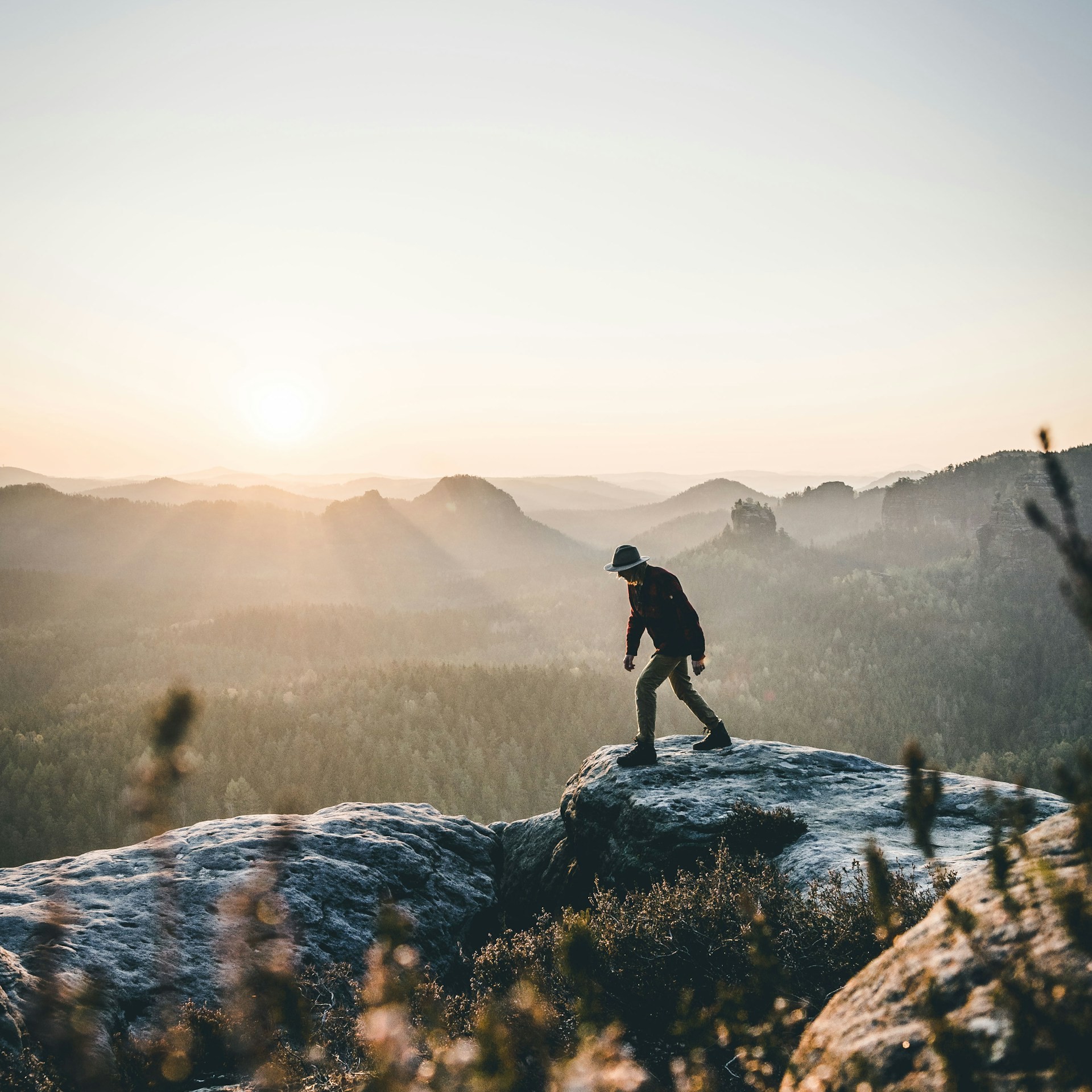 A hiker overlooking the sandstone formations of Saxon Switzerland National Park