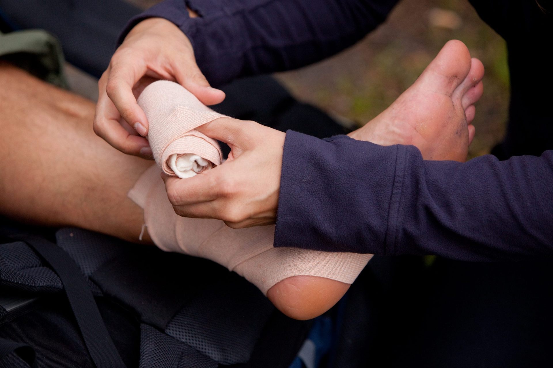 leg tensor bandage being applied outdoors