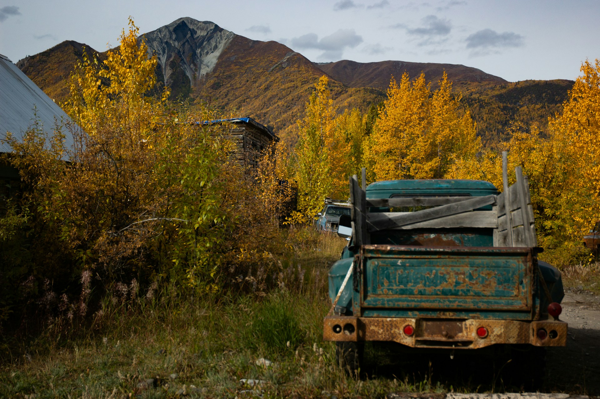 A remote dirt road and old truck near McCarthy in Wrangell–St. Elias